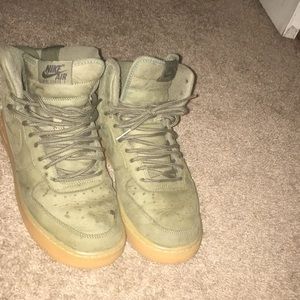 Green high top Nike ( one shoelace missing )
